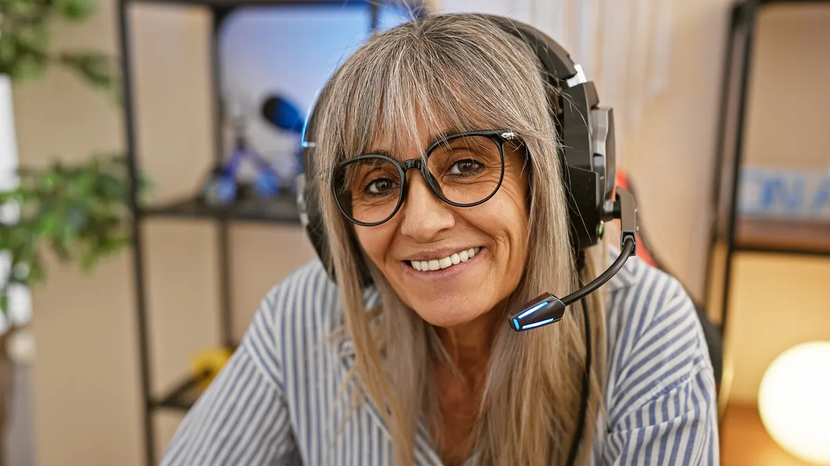 A friendly advisor with a headset in a cosy office